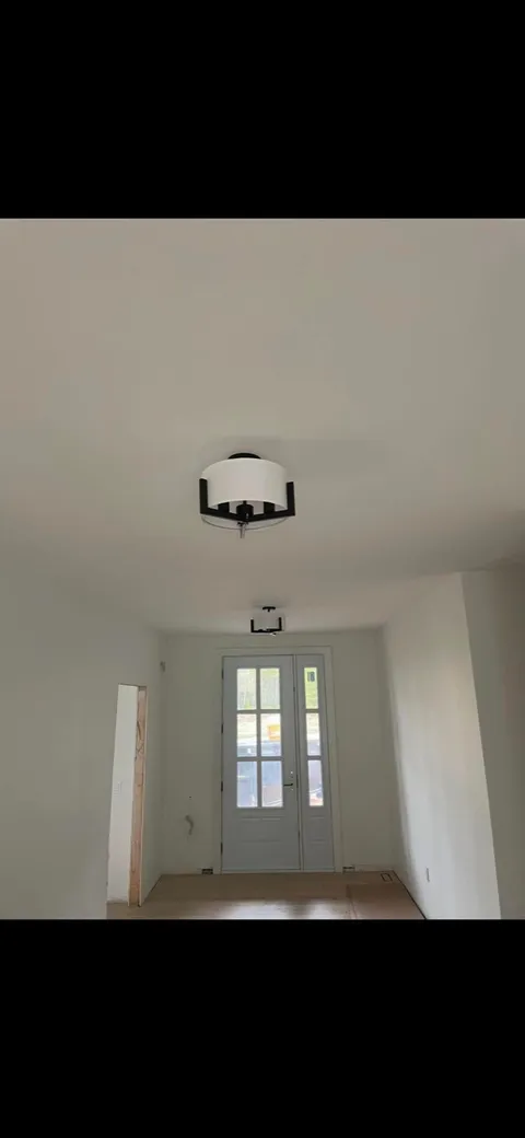 Semi-flush entry fixtures in a finished hallway